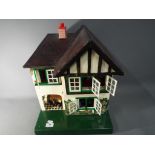 Dolls House - a dolls house by L Bros Tri-ang, two storey high, approx 42cm,