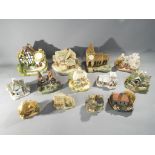A collection of thirteen miniature cottages including Lilliput Lane, Memory Lane,