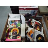 Lot to include 45 RPM vinyl records, music related books,