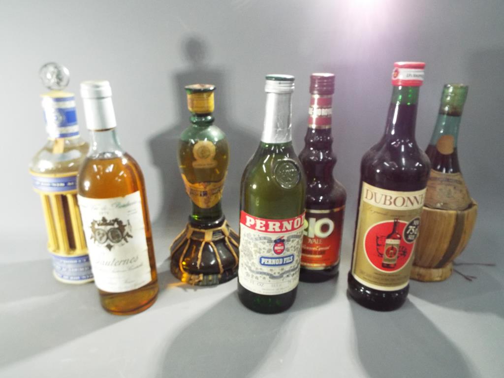 Seven bottle of drink to include Pernod, Dubonnet, Chianti, 1979 Souternes and similar.