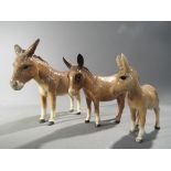 Beswick - a Beswick donkey family comprising two donkeys and a foal.