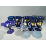 Five heavy blue glass goblets with hand painted gilt and floral decoration with two similar