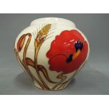 Moorcroft Potteries - a Moorcroft Potteries vase in the Harvest Poppy pattern approx 10cm (h) This