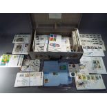A vintage suitcase containing a quantity of first day covers from 1960's, '70's, '80's and '90's.