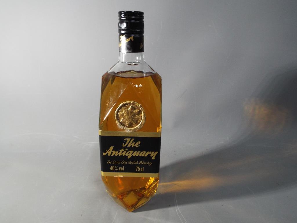 A bottle of Antiquary De Luxe old Scotch whisky 75cl 40% (1980's) This lot must be paid for and - Image 2 of 2