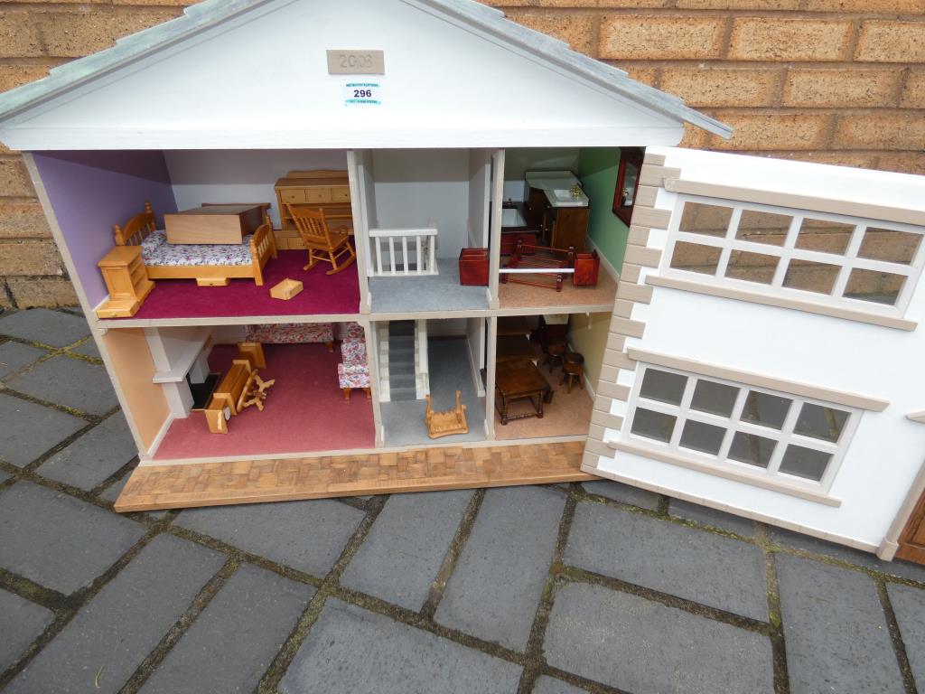 A wooden dolls house with accessories measuring approximately 57 cm x 72 cm x 38 cm. - Image 2 of 2