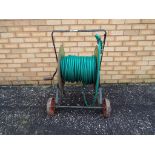 A garden hose trolley.