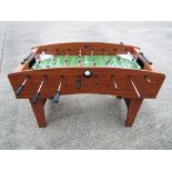 A good quality Solex table football game with footballs,