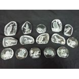 Fifteen clear glass/crystal paperweights all by Danbury Mint and Wedgwood (15) This lot must be