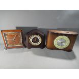 A bakelite case Smiths mantel clock, a Time Savings Clock and one other.