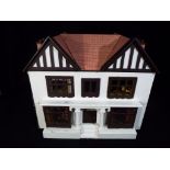 Dolls House - a dolls house standing approx 43cm (h),