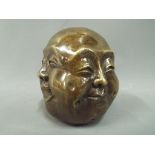 A brass four faced Buddha This lot must be paid for and removed no later than close of business on