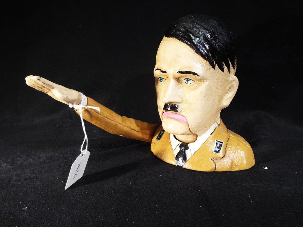 A cast iron nutcracker in the form of Hitler (mechanism works,