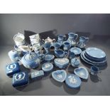 A quantity of predominantly powder blue Wedgwood Jasper Ware and blue and white ceramics.