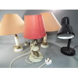 A quantity of onyx table lamps and similar.