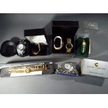 A collection of boxed wristwatches to include Limit, Texet, Accurist and similar and a boxed clock.