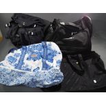 Four travel/carry bags to include large blue and white Cath Kidstone bag, black tote Samsonite bag,