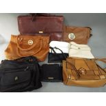 A collection of good quality handbags and zip ring binder to include some leather,