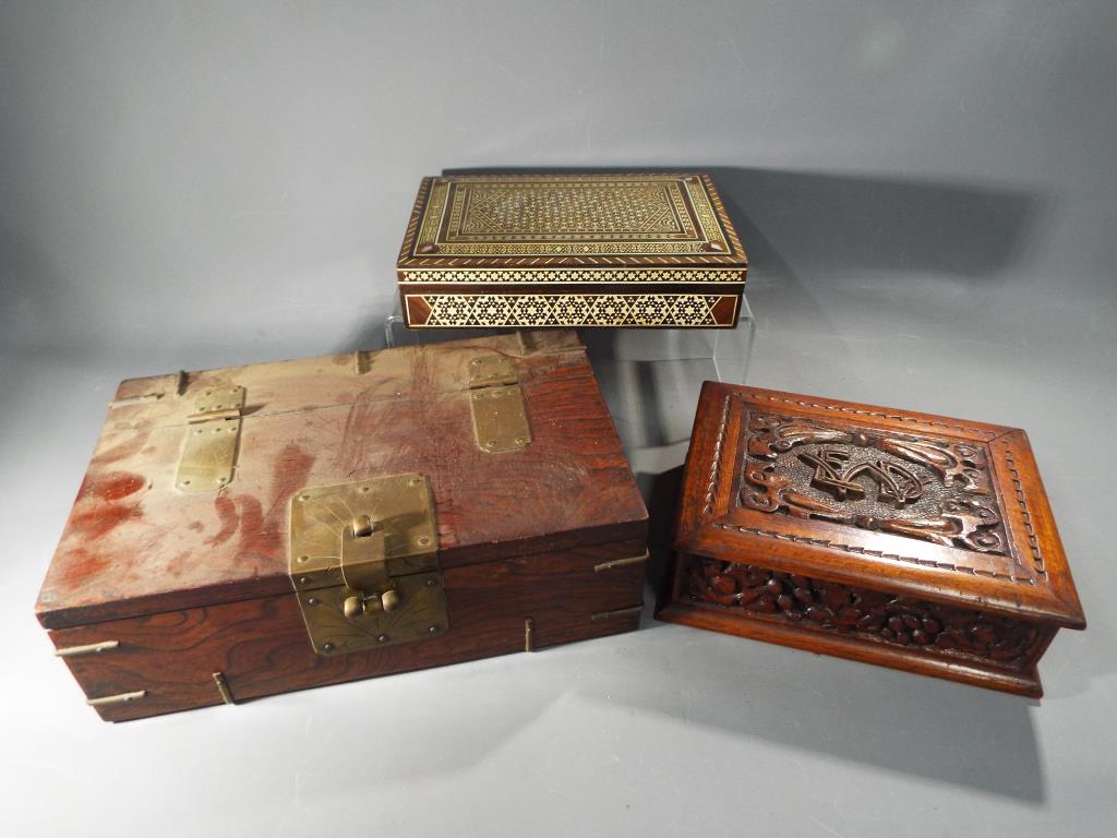 Three small decorative storage boxes, the largest approximately 10 cm x 30 c m x 20 cm.