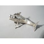 A Spanish articulated silver model of a fish,