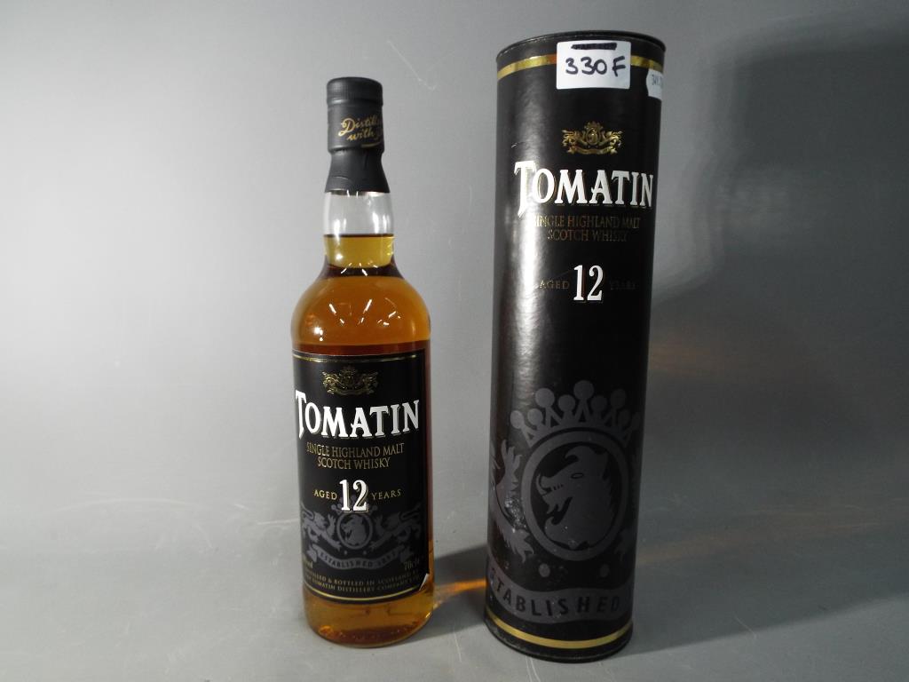 A bottle of 12 year old Tomatin single Highland Malt Scotch whisky,