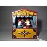 A cast iron novelty mechanical money bank in a form of Punch and Judy [XBB&J] This lot must be paid