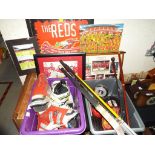 A large mixed lot of sporting related memorabilia and equipment to include hockey sticks, ski boots,