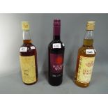 A lot containing three bottles to include a five year old Clan Dew Scotch malt whisky,