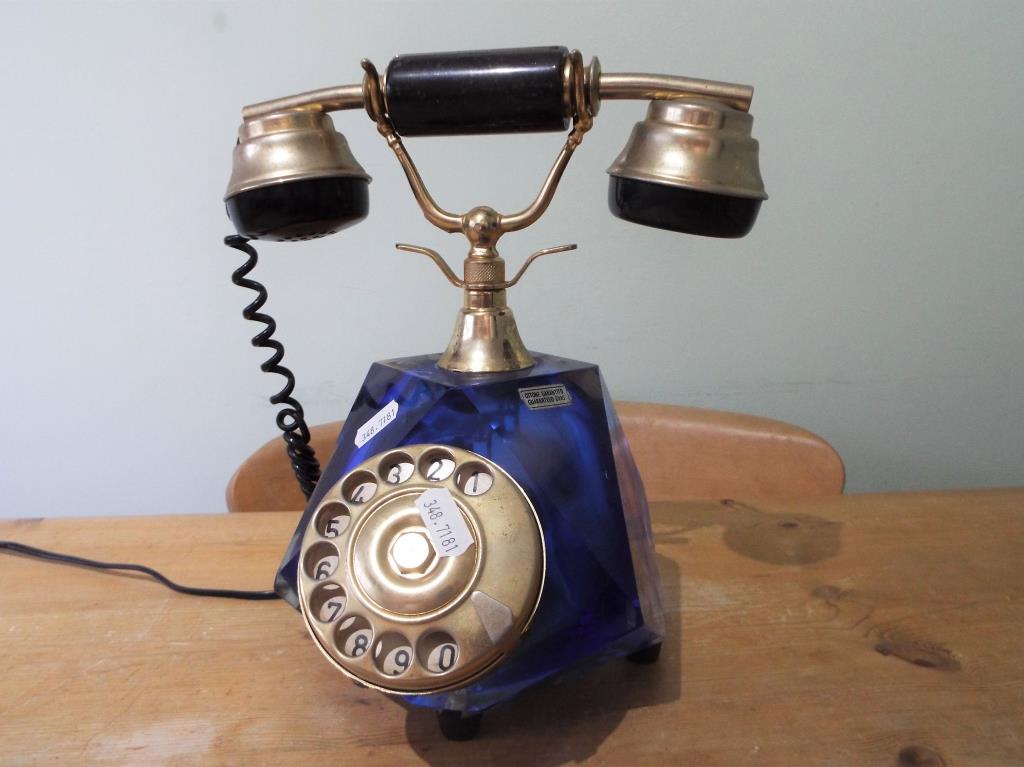 A vintage Italian salon telephone with faceted blue glass body with gilded metal mounts,