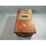 A vintage wooden cash register.