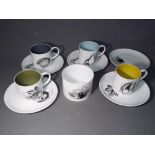 Four Black Fruit Demitasse coffee cups (dia. 6.5cm) and saucers (dia.