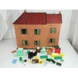 A two storey wooden dolls house with lights fitted, but untested,