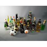 A good mixed lot of approx 30 miniature collectables to include a ceramic Beneagles Scotch whisky