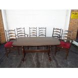 An Ercol dining table, approximately 72 cm x 153 cm x 77 cm, with six chairs.