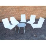 A small occasional table with four modern matching chairs and one similar [6] This lot must be paid