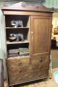 Victorian oak linen press having two doors above four drawers on turned legs,