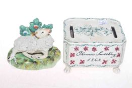 Porcelain child's money box (Thomas Sweeting) 1869, 12cm, and a Staffordshire sheep figure,