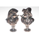 Pair of copper effect metal busts depicting a young boy and girl with a bird on their shoulders,