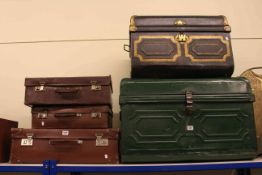 Two tin trunks and three suitcases