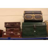 Two tin trunks and three suitcases