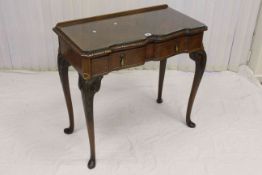 Walnut shaped front cutlery table on cabriole legs, the drawer stamped A.W. Brown, Lancaster, 75.