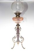 Late Victorian ornate oil lamp with coloured glass reservoir and etched shade