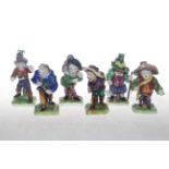 Set of six Continental porcelain dwarf figures