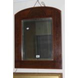 Arched poker work framed bevelled wall mirror