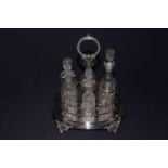 Victorian ornate six bottled cruet on foliate feet