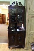 Late Victorian mahogany Chippendale style corner cabinet having two glazed panelled doors above two
