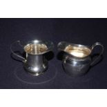 Two silver cream jugs, Chester 1911 and Birmingham 1937,