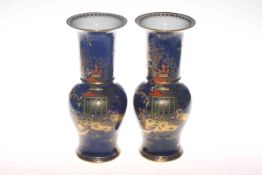 Carlton Ware pair of chinoiserie vases on a blue background,