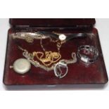 Estee Lauder box of costume jewellery including watches and a silver ingot