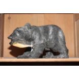 Carved wood bear with a fish,